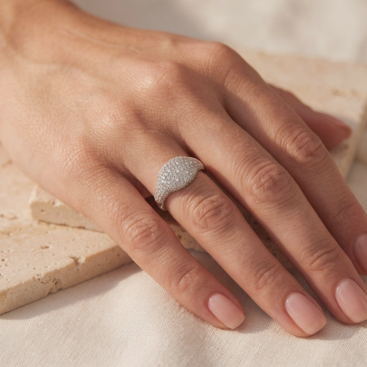 14K and 18K solid gold pave dome ring in white gold with simulated diamonds.