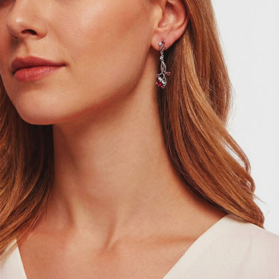 Valisara solid gold drop earrings with simulated rubies.