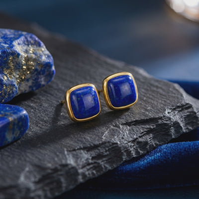A pair of yellow gold cushion-cut lapis lazuli earrings, a type of solid gold earring.