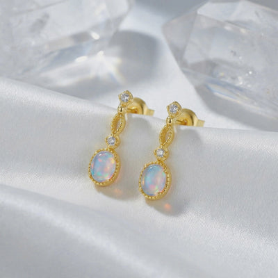Lorelei Oval Opal drop earrings in solid gold.