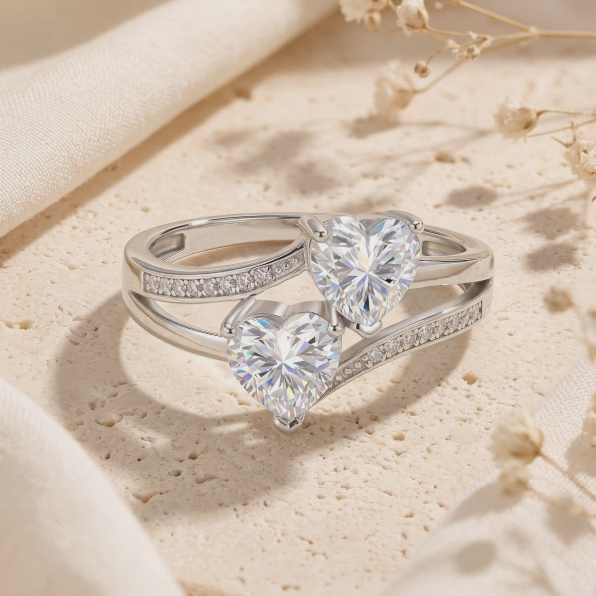 Twin heart bypass ring in solid gold with natural zircons.