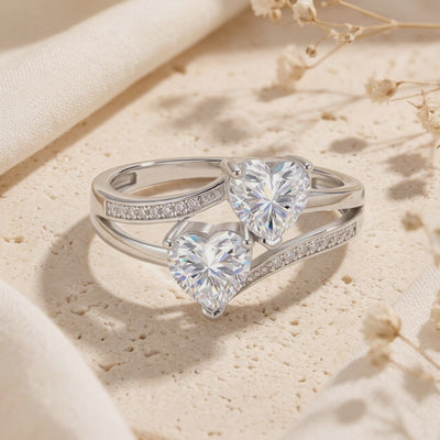 Twin heart bypass ring in solid gold with natural zircons.