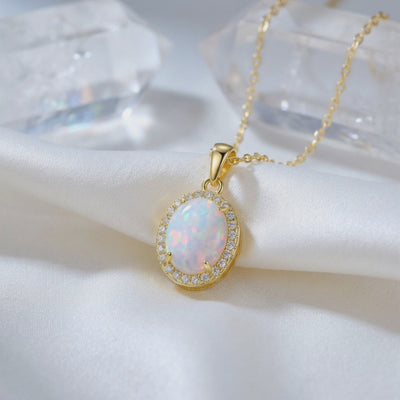 Oval opal pendant necklace in solid gold.