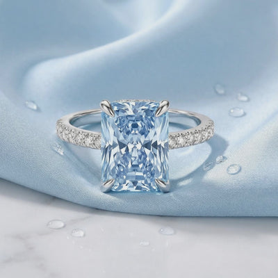 Radiant simulated aquamarine ring in solid gold.