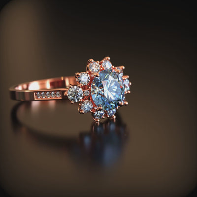 The Bethany 1.5 carat blue moissanite halo ring in solid gold.