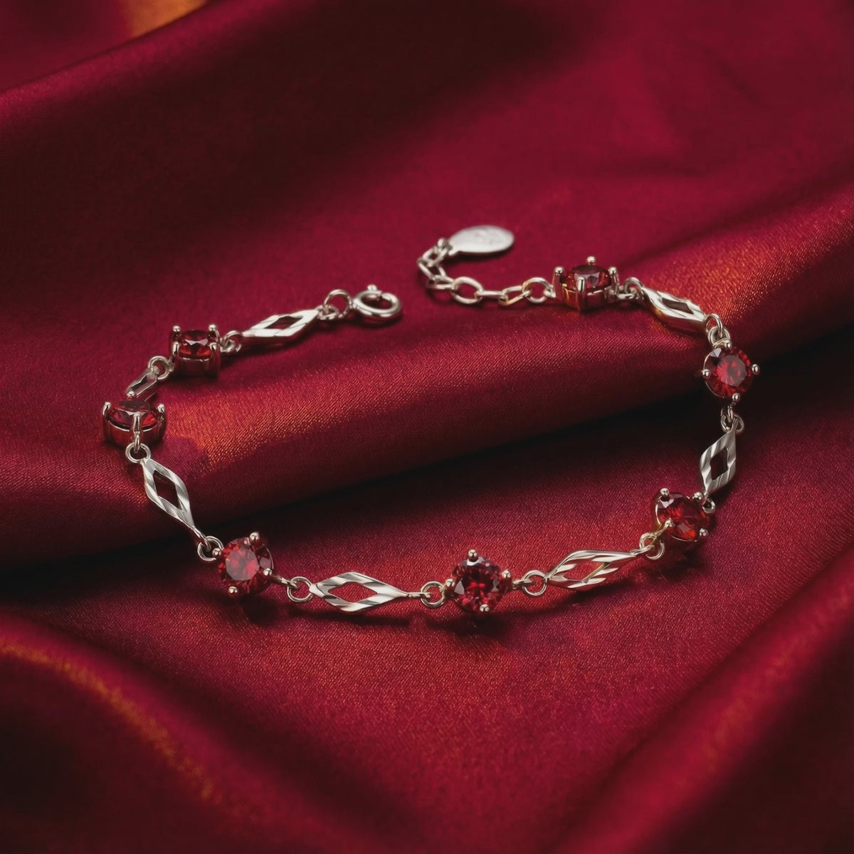 Aderyn Station Bracelet in solid gold with simulated rubies.