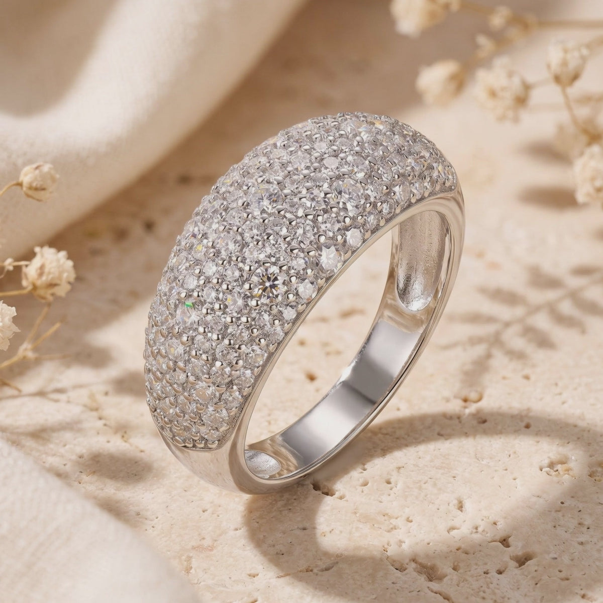 Solid gold ring with pave-set cubic zirconia.