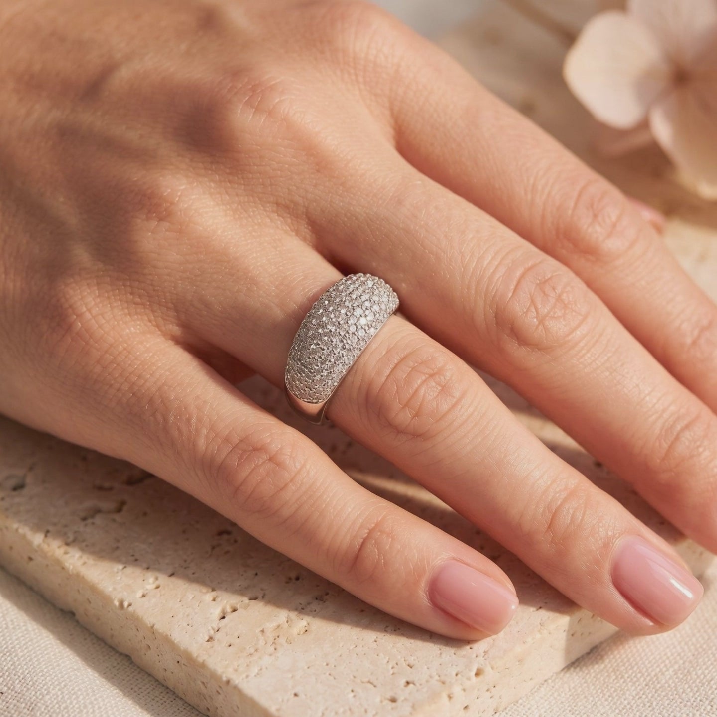 Solid gold ring with pave-set cubic zirconia.