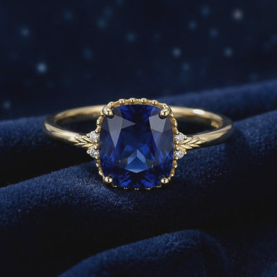 The Arisara cushion cut simulated sapphire ring in solid gold.