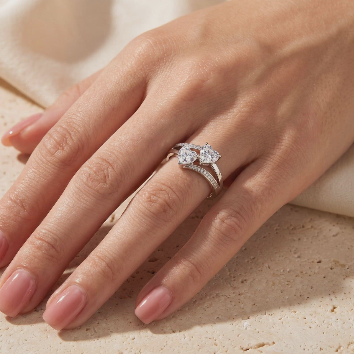 Twin heart bypass ring in solid gold with natural zircons.