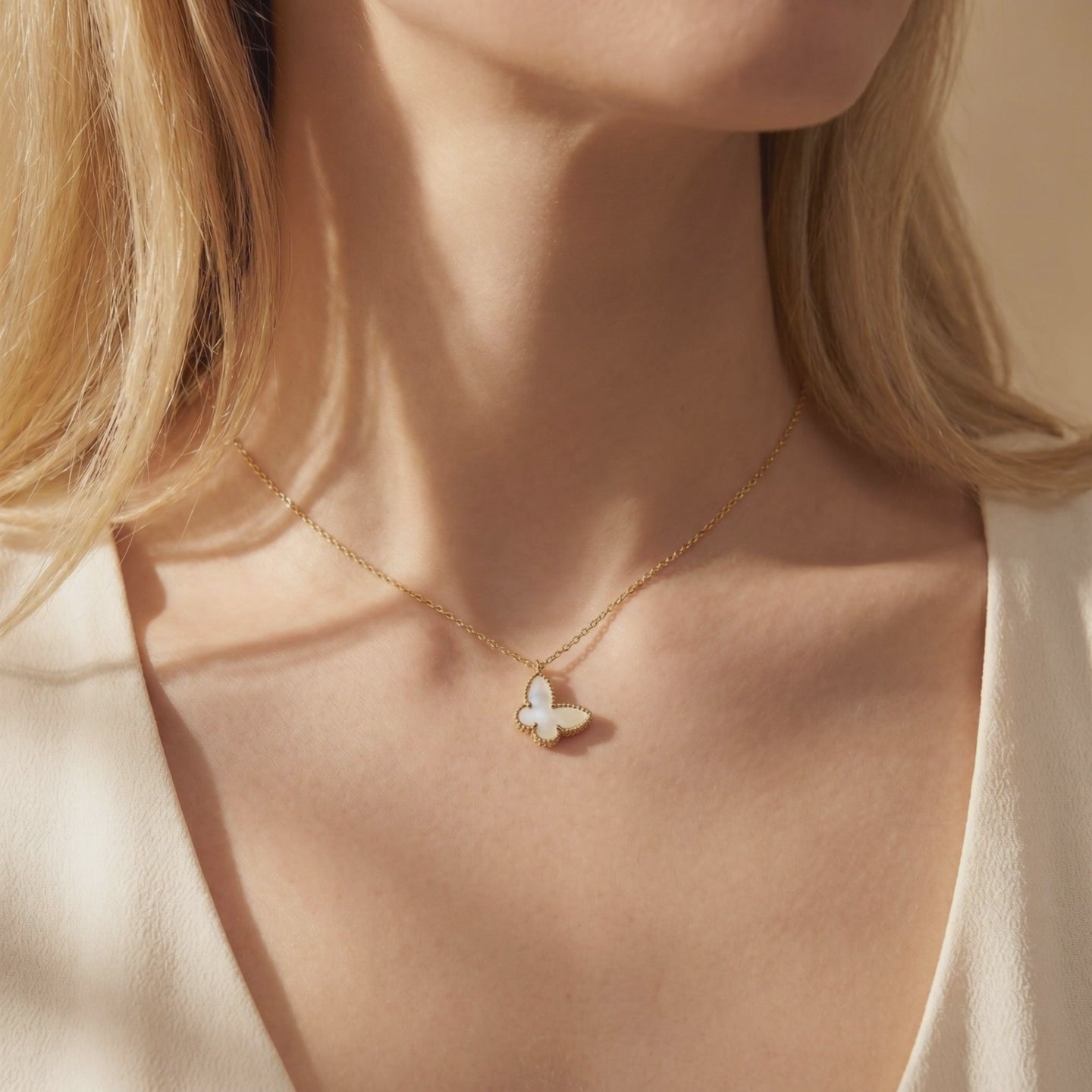 Farfalla Mother of Pearl butterfly pendant necklace in solid gold.