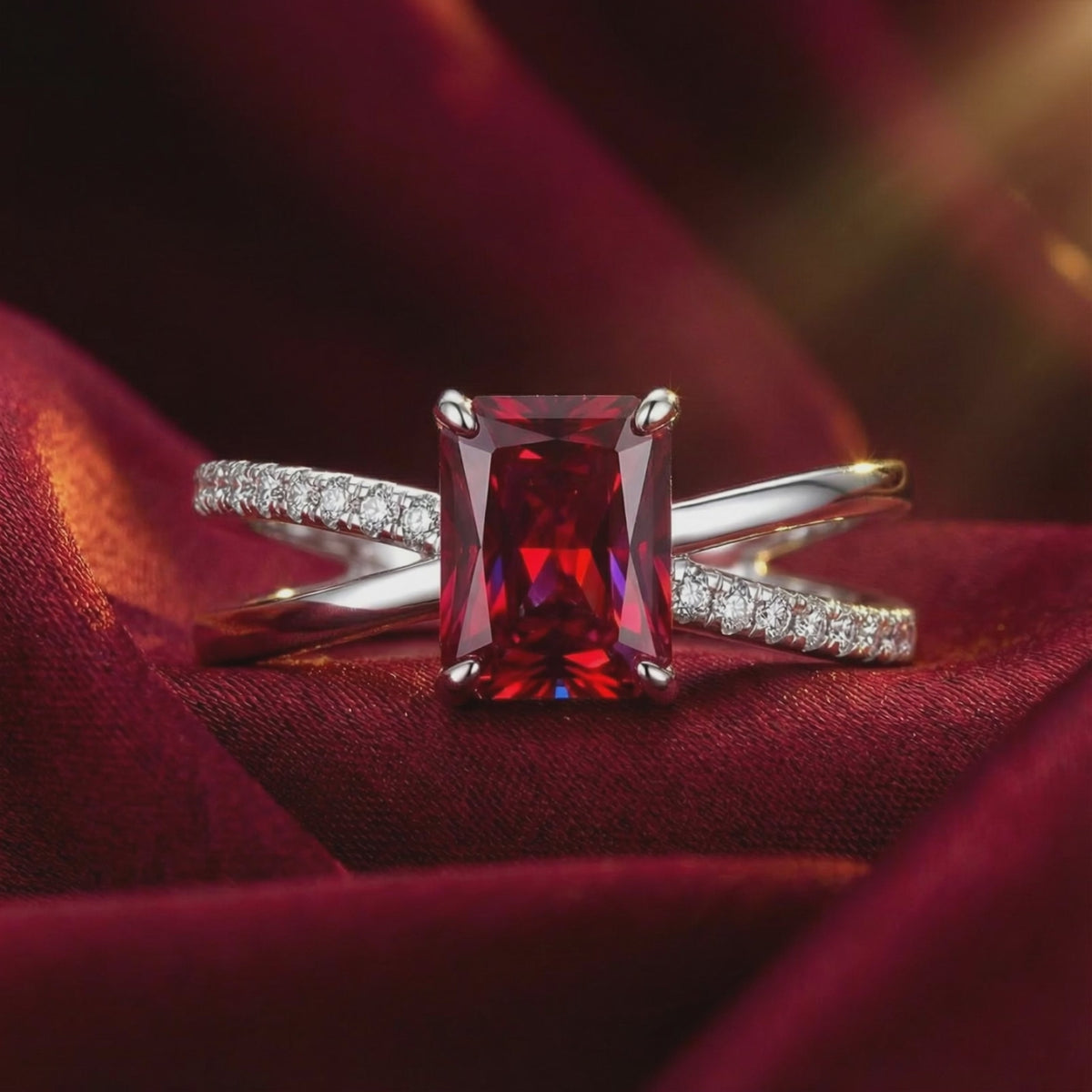 A solid gold ring featuring a radiant cut simulated ruby.