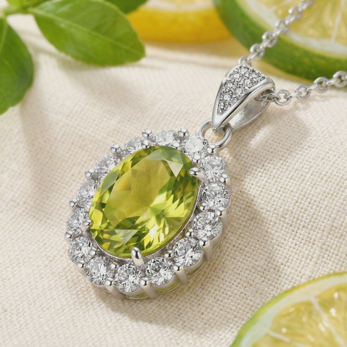 A dynamic view of The Mirara Halo simulated peridot pendant necklace in solid gold.