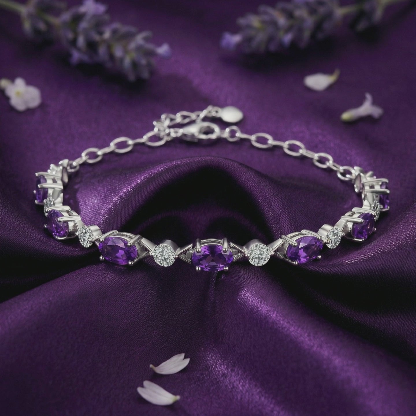 A solid gold bracelet with natural amethyst and simulated diamond accents.