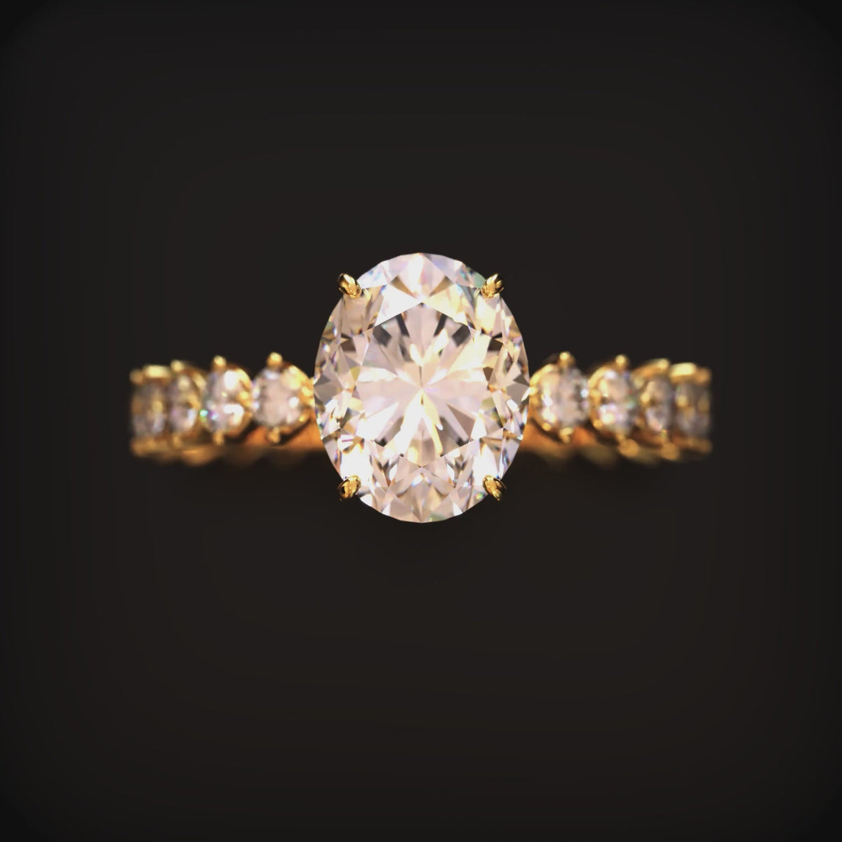 A solid gold ring with a 2 carat oval moissanite center stone.