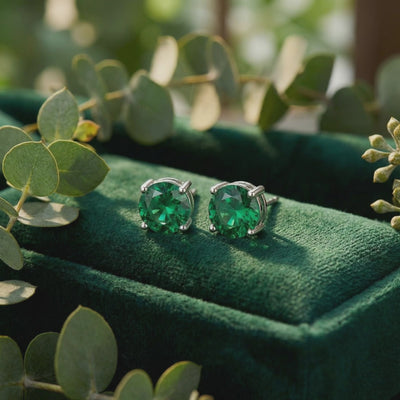 Simulated emerald stud earrings in solid gold.