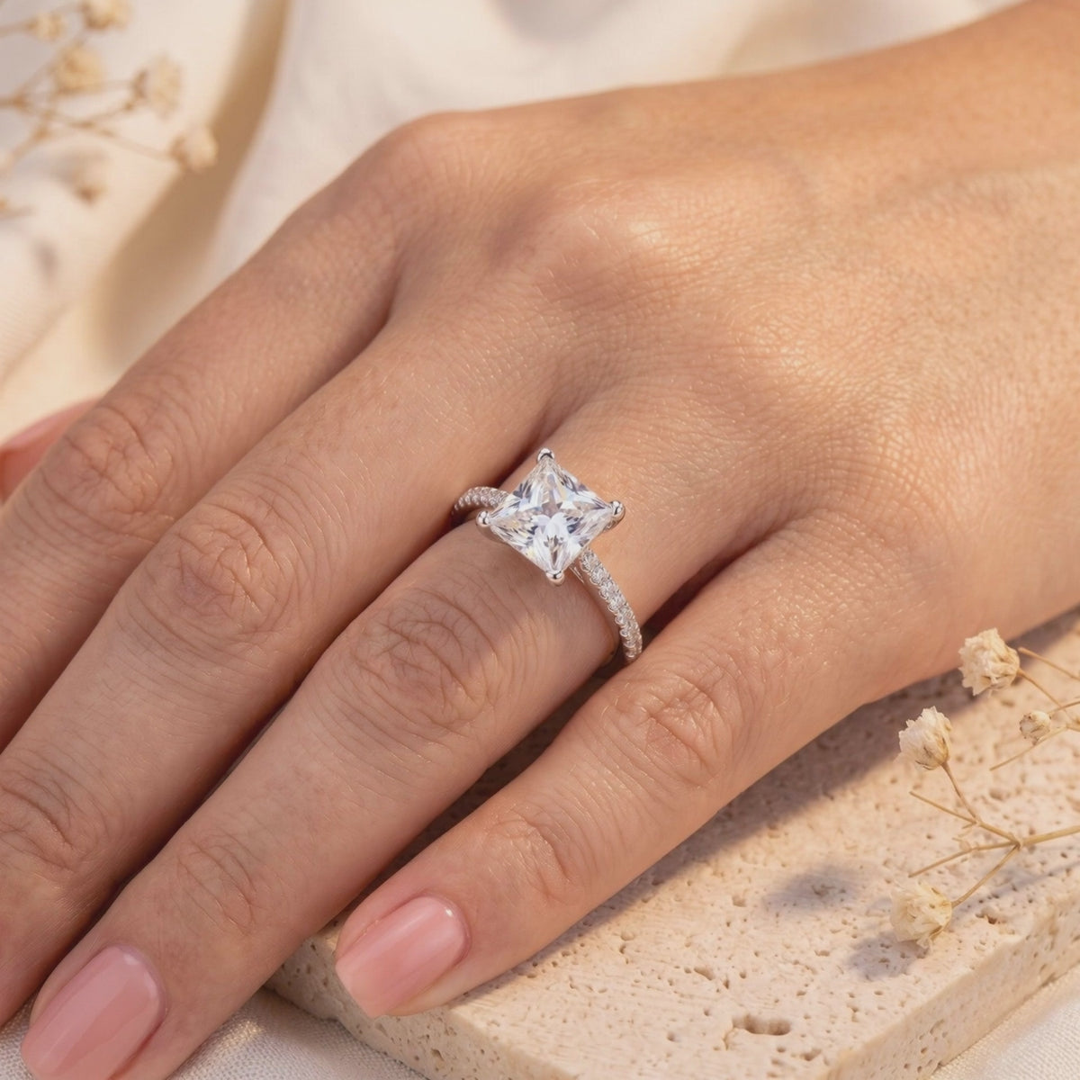 A solid gold ring featuring a princess-cut natural zircon center stone.