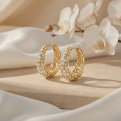Corabelle moissanite J-hoop earrings in solid gold.