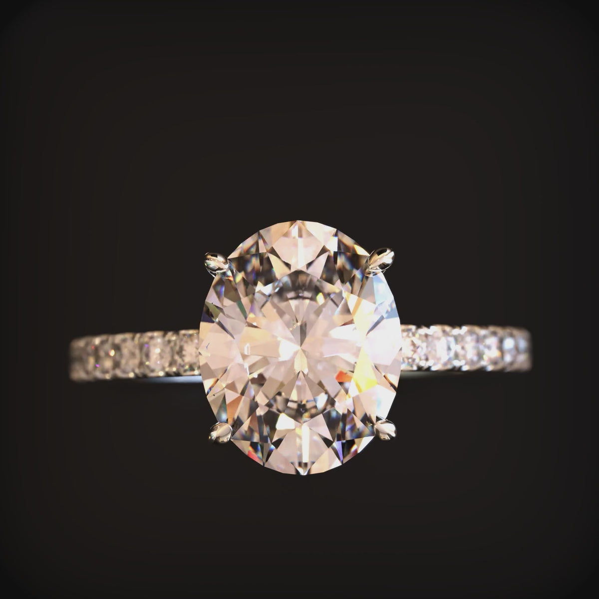 Video of The Liana 3 carat oval moissanite ring crafted in 14K solid white gold.