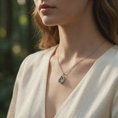 Natural Moss Agate Teardrop Necklace in solid white gold showcasing the unique green inclusions.