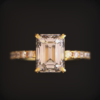 Video of The Cecily Jane solid gold ring with emerald-cut moissanite and accent stones