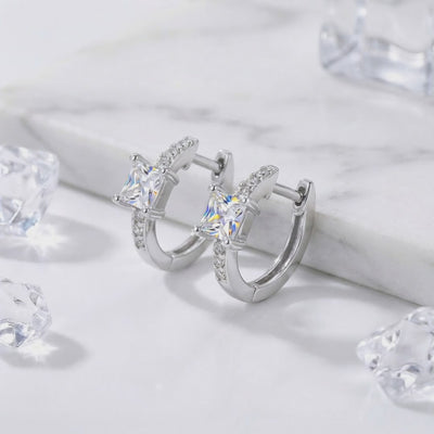 Princess-cut simulated diamond huggie earrings crafted in solid gold.