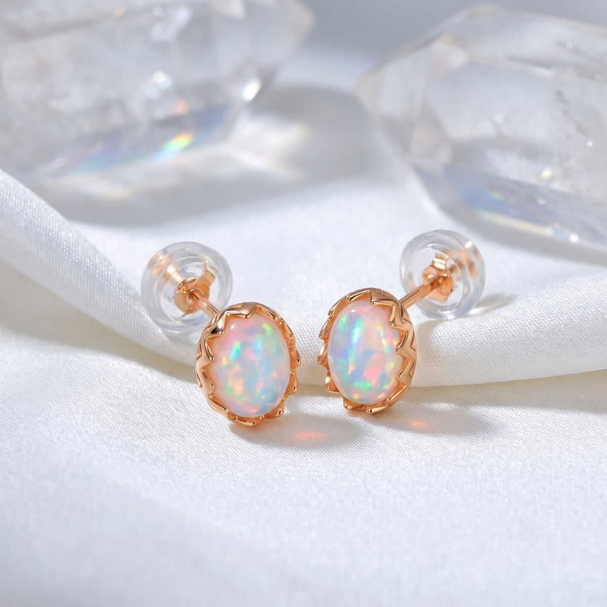 The Novalie Oval Opal stud earrings in a solid rose gold setting.