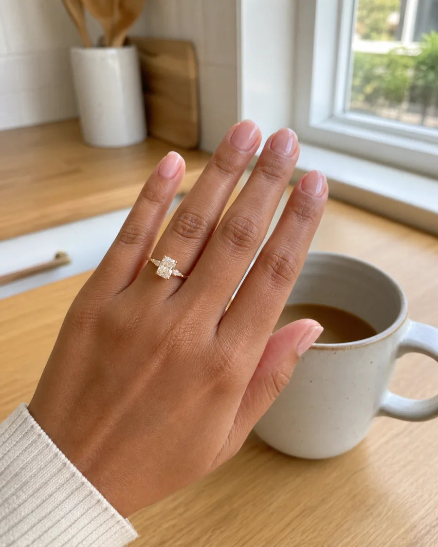Radiant-cut fine-jewelry ring worn during a quiet morning at home